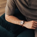 The Nostalgia Desert is crafted from walnut wood and stainless steel, featuring a beige dial, light brown vegan leather strap, and brushed silver metal details.