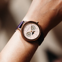 The Selene Raspberry Royale is crafted from walnut wood, featuring a pink dial, violet vegan strap, and golden details.