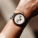 The Selene Azure Frost is crafted from walnut wood, featuring a white dial, light blue vegan strap, and golden details.
