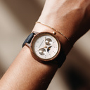 The Selene Blue Dream is crafted from walnut wood, featuring a white dial, navy blue vegan strap, and golden details.