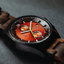 Phoenix is made of Black Sandalwood, featuring an orange dial.