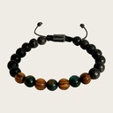 Made with rosewood beads, volcanic beads, dark green natural stone beads, and a matte black brass closure. Adjustable, with 8mm beads to fit most wrist sizes.