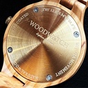 The Radiance Rose Champagne is crafted from olive wood and stainless steel brushed gold, featuring a light pink dial and brushed gold metal details.