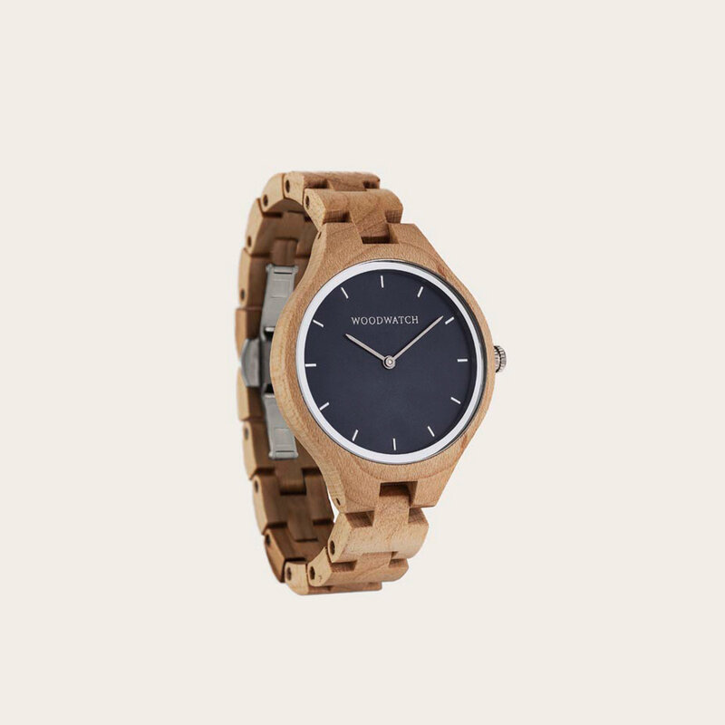 The AURORA Collection breaths the fresh air of Scandinavian nature and the astonishing views of the sky. This light weighing watch is made of Canadian Maplewood, accompanied by a blue stainless-steel dial with silver details.<br />
The watch is available with a