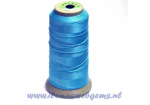 Large roll of basting thread light blue