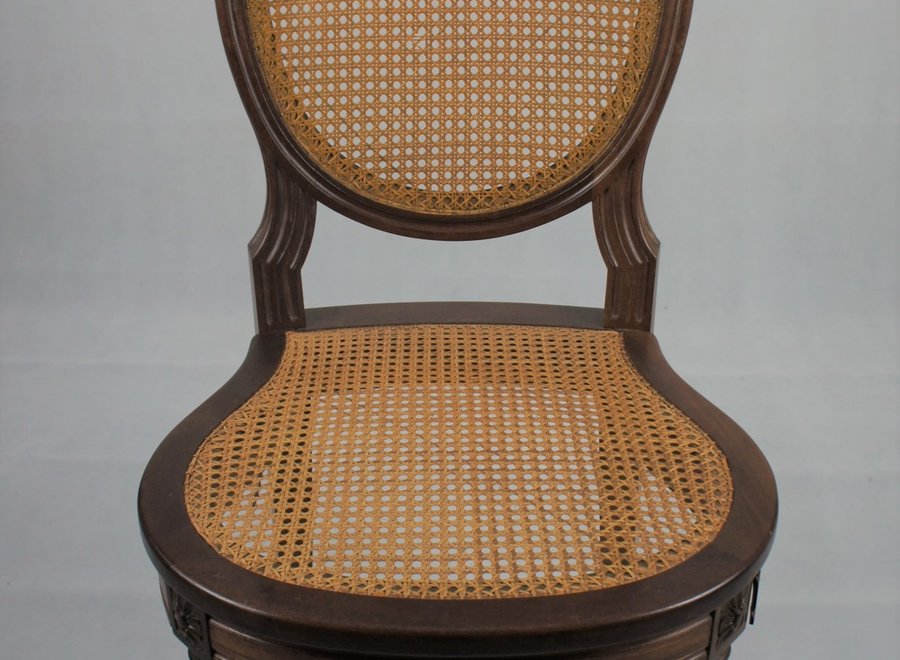 Elegant chair in Louis Philippe style with beautiful authentic cannage on the back and seat.