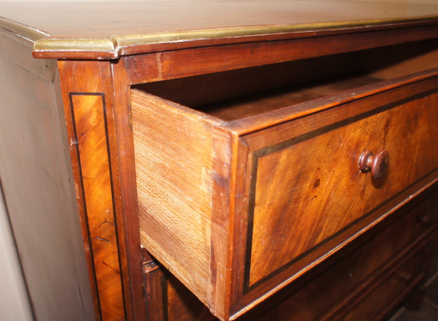 Antique chest of drawers in various types of wood