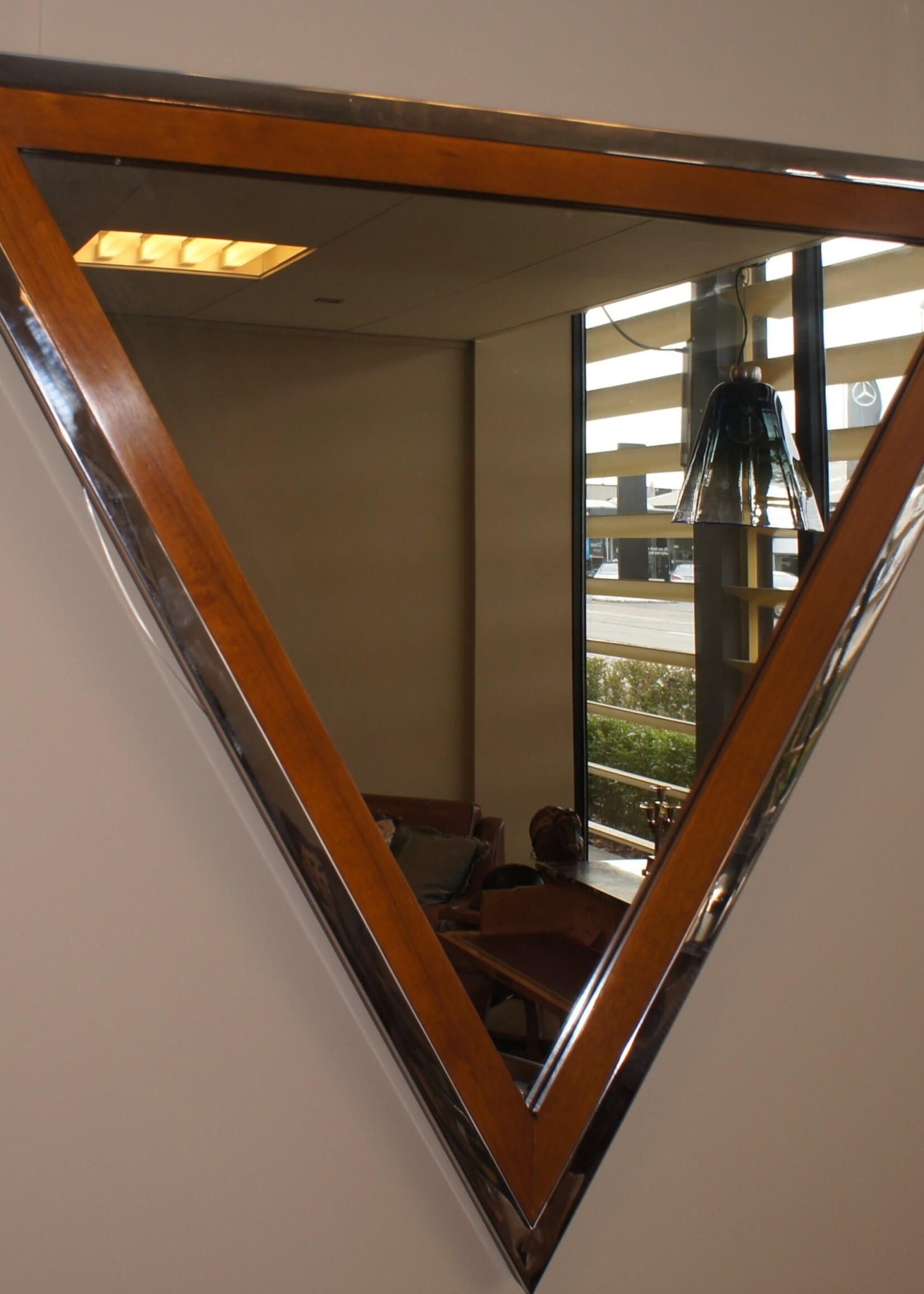 Wooden frame mirror with additional elegant chrome finish