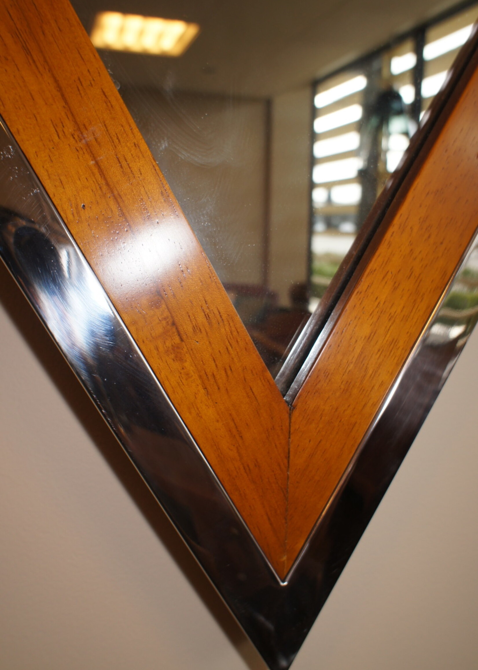 Wooden frame mirror with additional elegant chrome finish