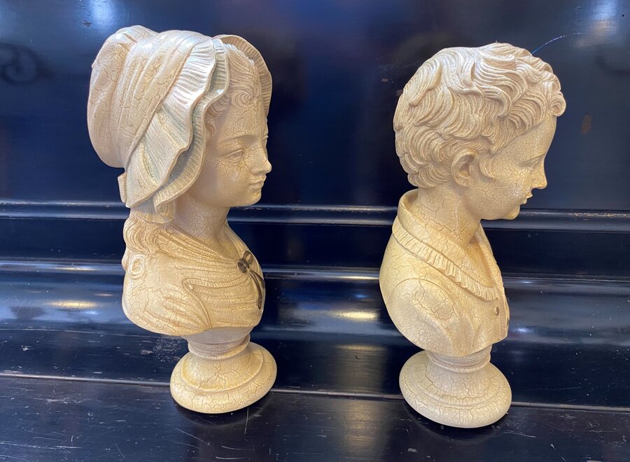 Busts of young children in resin