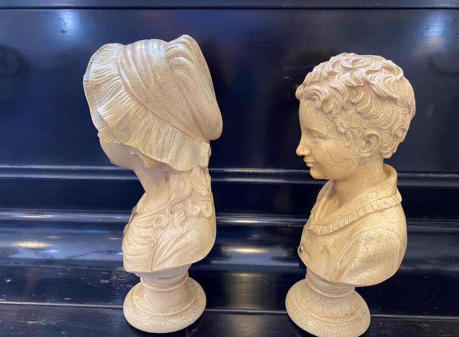 Busts of young children in resin