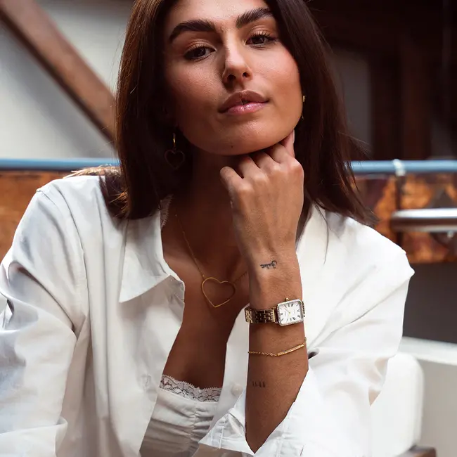 Goudkleurig horloge met metalen armband en zirkonia