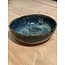 artisann In the mold laid round dish of Belgian clay with a beautiful Floating blue highly fired glaze.