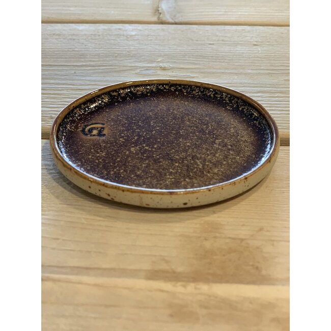 artisann With the turntable handmade plate of speckled Pyriet clay with a beautiful Floating orange brown white high-firing glaze.