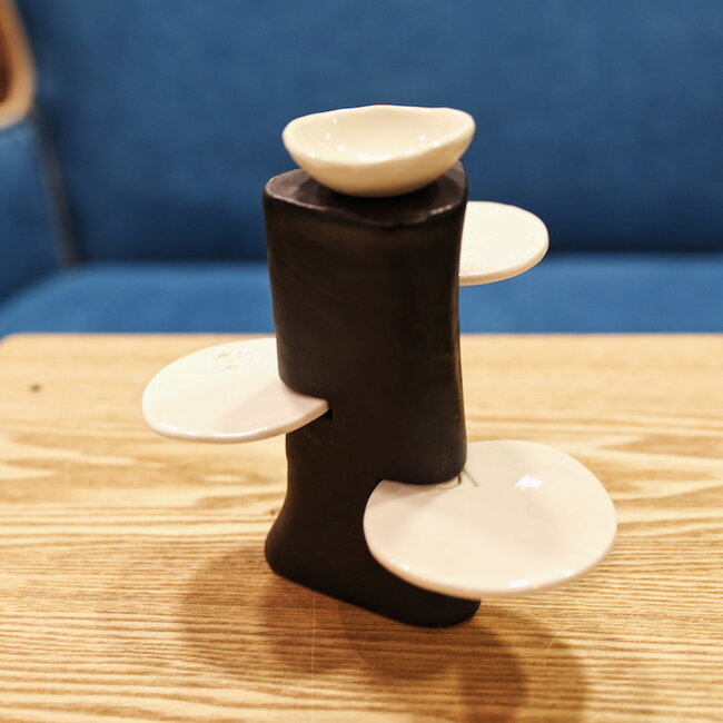 Handmade table ornament in a straight shape with porcelain accessories