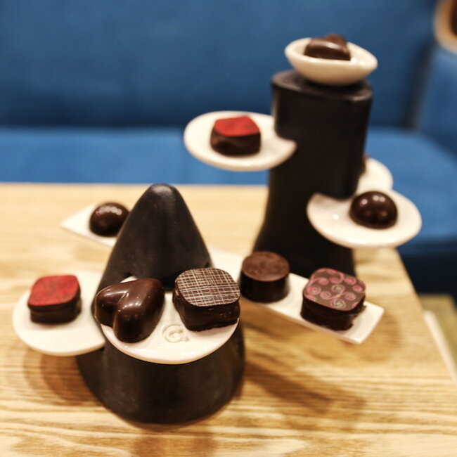 Handmade table ornament in a pyramide shape with porcelain accessories