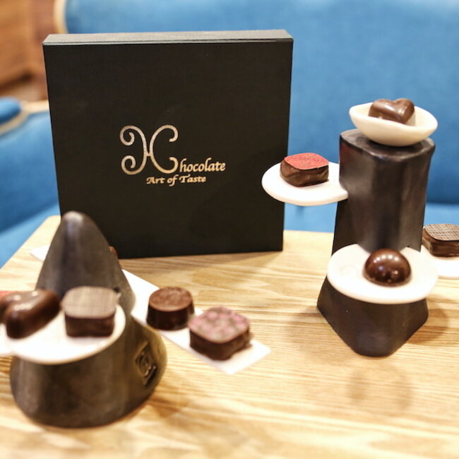 Handmade table ornament in a pyramide shape with porcelain accessories