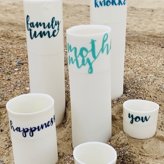 "My Knokke" speak for themselves in a unique porcelain vase in cylinder form