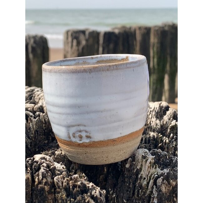 artisann With the turntable handmade cup made with Belgien clay with a beautiful opal white high firing glaze.