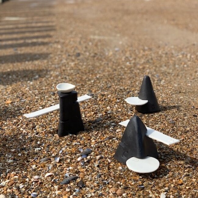 Handmade table ornament in a pyramide shape with porcelain accessories