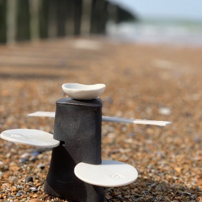 Handmade table ornament in a straight shape with porcelain accessories