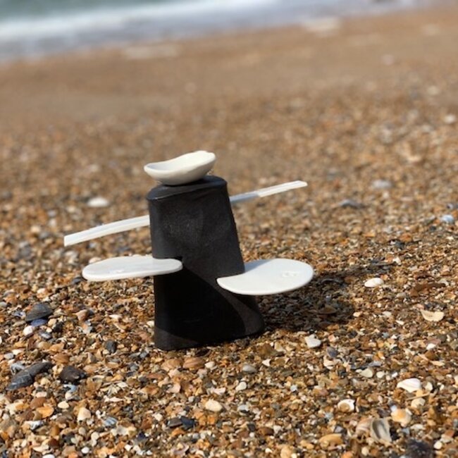 Handmade table ornament in a straight shape with porcelain accessories