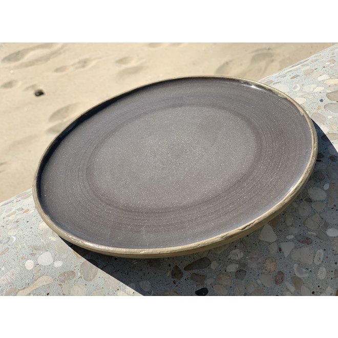 Plate handmade in ceramic from gray cast clay and natural ocher border