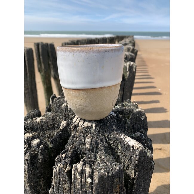 artisann With the turntable handmade cup made with Belgien clay with a beautiful opal white high firing glaze.