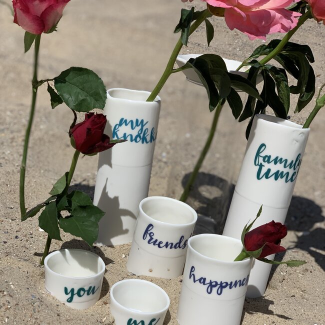 "Familytime" speak for themselves in a unique porcelain vase in cylinder form