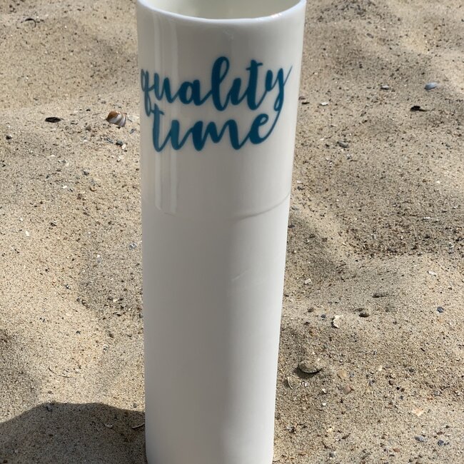 "Qualitytime" speak for themselves in a unique porcelain vase in cylinder form