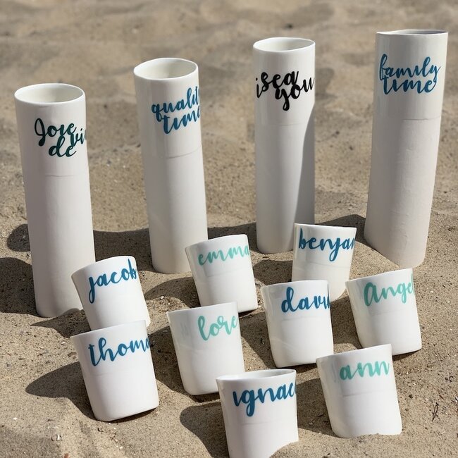 "Qualitytime" speak for themselves in a unique porcelain vase in cylinder form