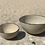 Bowl in the shape of a hemisphere handmade in ceramic with black hand-painted edge