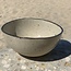 Bowl in the shape of a hemisphere handmade in ceramic with black hand-painted edge