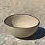 Bowl in the shape of a hemisphere handmade in ceramic with black hand-painted edge