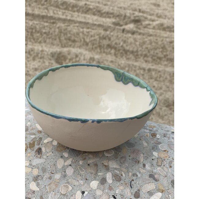 LS-design Bowl handmade in beige cast clay finished with a green, blue edge.