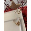 artisann Porcelain handmade Christmas service with accents of golden stars and a Christmas tree