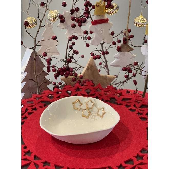 Porcelain handmade Christmas service with accents of golden stars and a Christmas tree