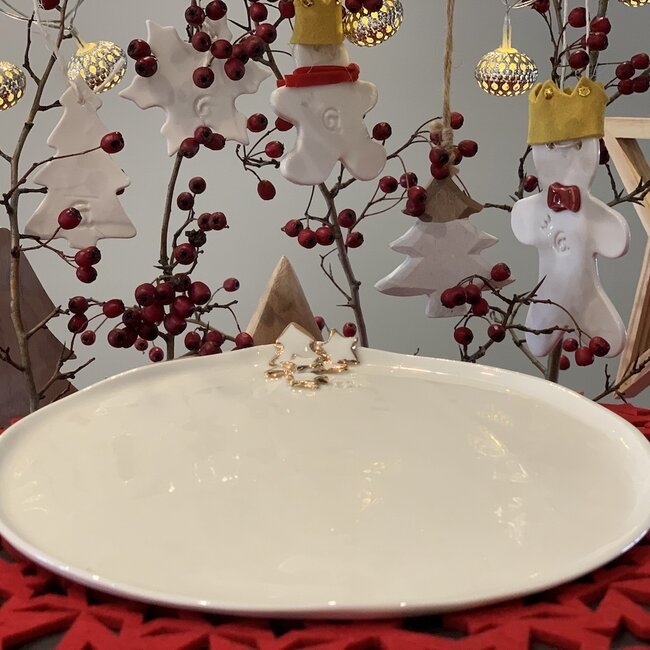 Porseleinen handgemaakt Kerstservies met accenten van gouden sterren en een kerstboompje