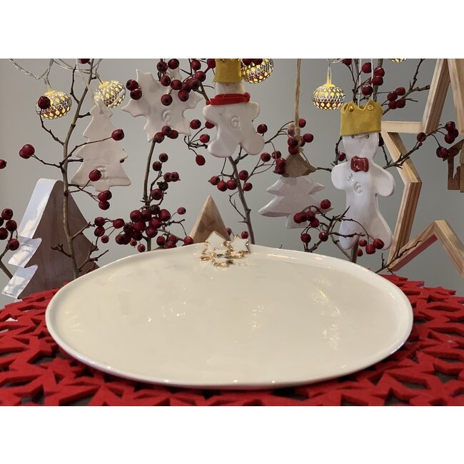 artisann Porcelain handmade Christmas service with accents of golden stars and a Christmas tree