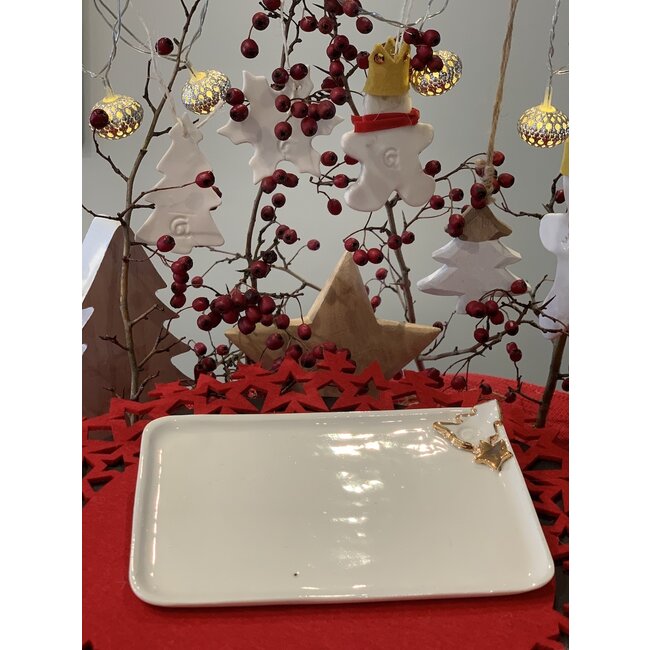 artisann Porcelain handmade Christmas service with accents of golden stars and a Christmas tree