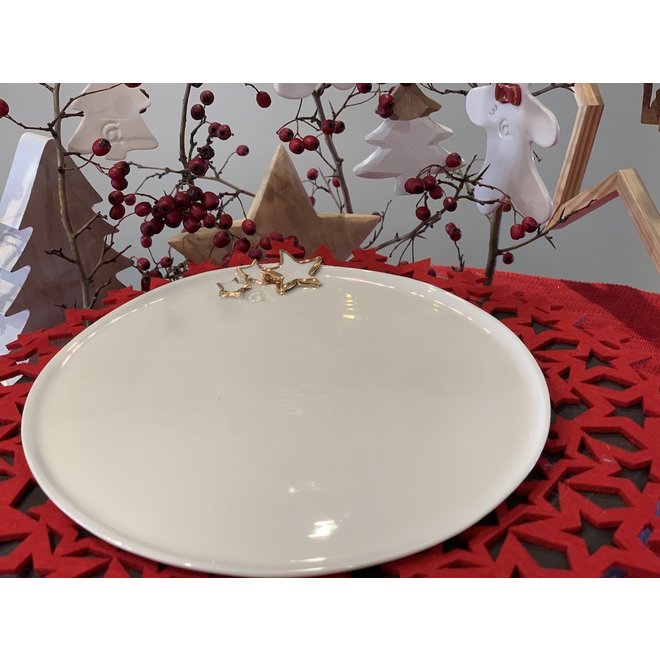 Porcelain handmade Christmas service with accents of golden stars and a Christmas tree