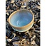 artisann With the turntable handmade bowl of Pottery clay with a beautiful Floating light blue high-firing glaze.