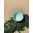 artisann With the turntable handmade bowl of Puerite clay with a beautiful Floating green high-firing glaze.