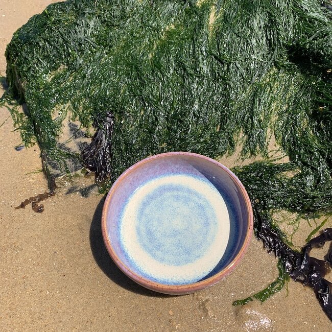 With the turntable handmade scale of Pyerite clay with a beautiful floating magenta, rose high-firing glaze.