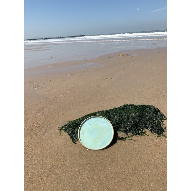 artisann With the turntable handmade plate with naturelle clay and a beautiful green high firing glaze.