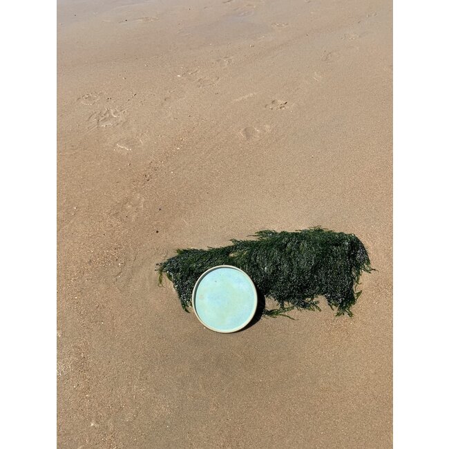 artisann With the turntable handmade plate with naturelle clay and a beautiful green high firing glaze.