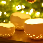Handmade porcelain tea lights illuminate your interior with cosiness