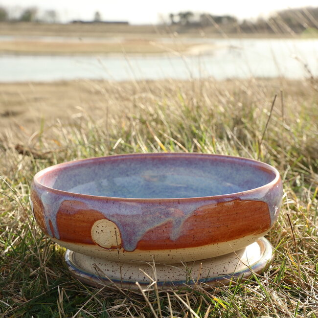 With the turntable handmade scale of Pyerite clay with a beautiful floating magenta, rose high-firing glaze.
