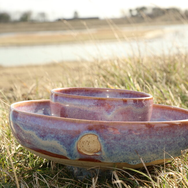With the turntable handmade scale of Pyerite clay with a beautiful floating magenta, rose high-firing glaze.