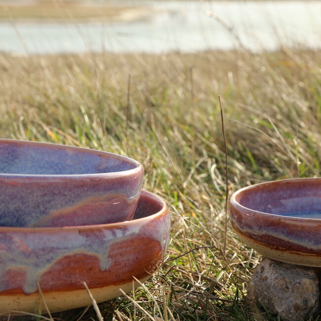 With the turntable handmade scale of Pyerite clay with a beautiful floating magenta, rose high-firing glaze.